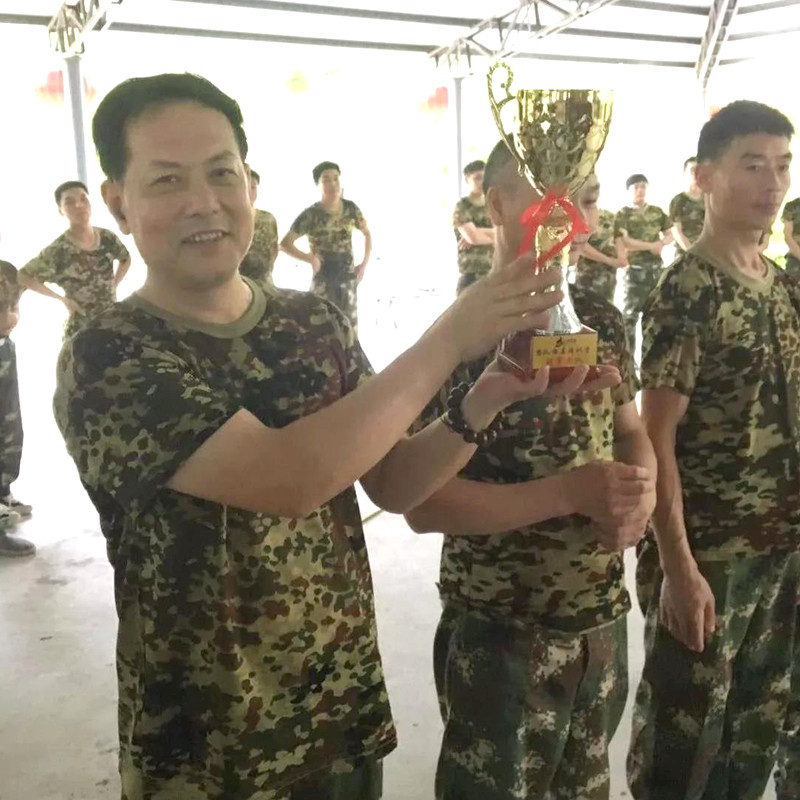 Captain of Innovative Vanguard Team Showing Trophy